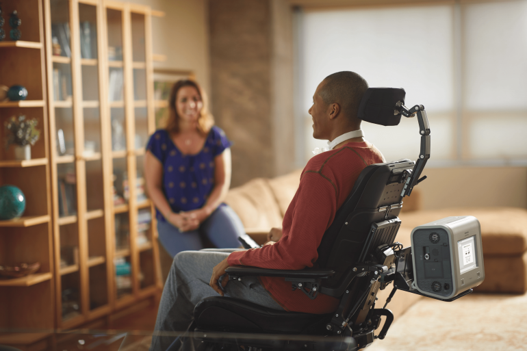 Photo of the Trilogy Evo on the back of a wheelchair